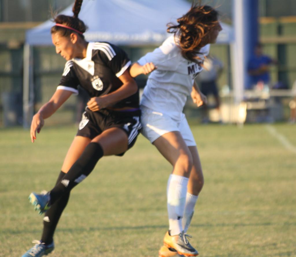 Sophomore defender Alyssa Cabral in a mid-air collision while going after the ball. 