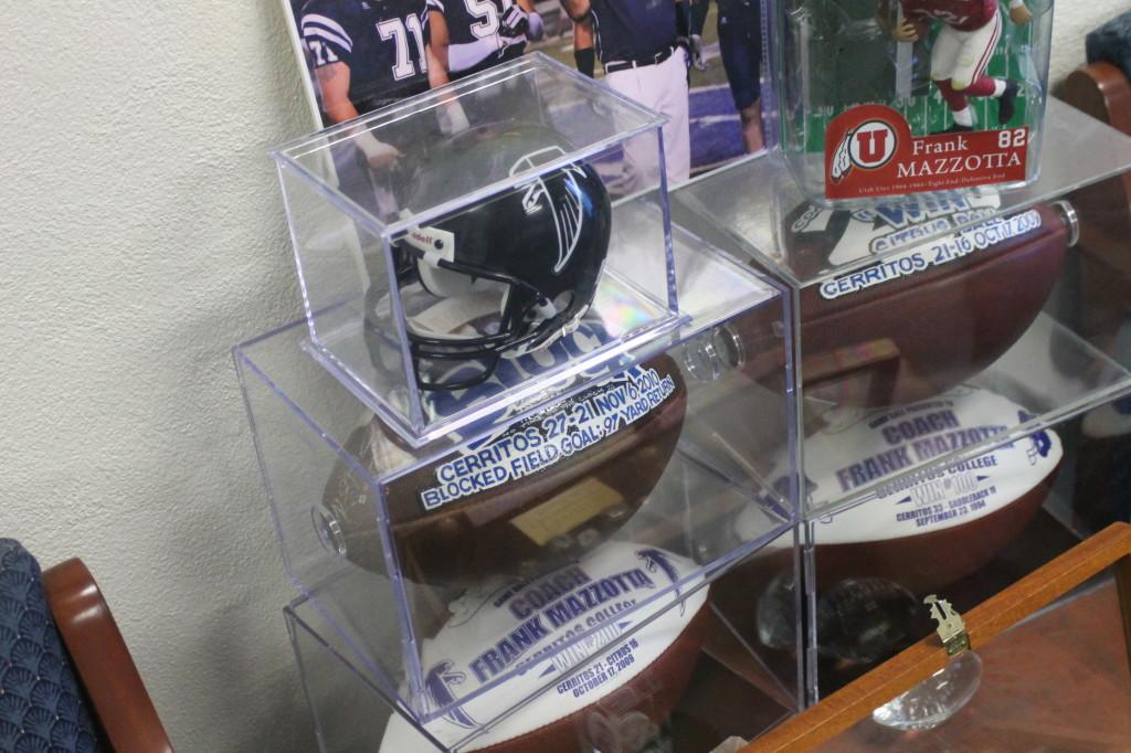 In this angle you see more memorabilia which includes the football helmet four footballs that highlights his tenures in other schools.