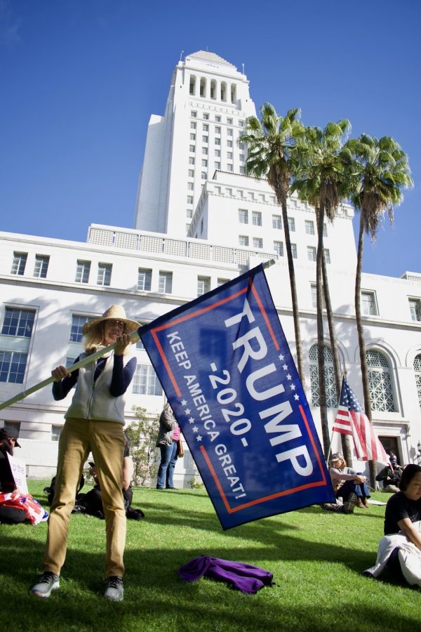 Trump supporter Donna Kaye protests the presidential election at Los Angeles city hall on Jan. 6. She believes the election was stolen because News Max continues to give voice to conspiracy theories on how Democrats rigged the election. 