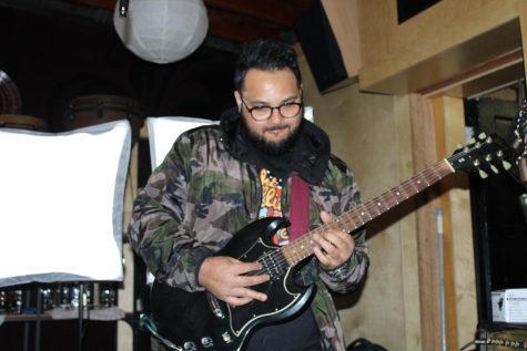 Sunny Shrestha playing guitar