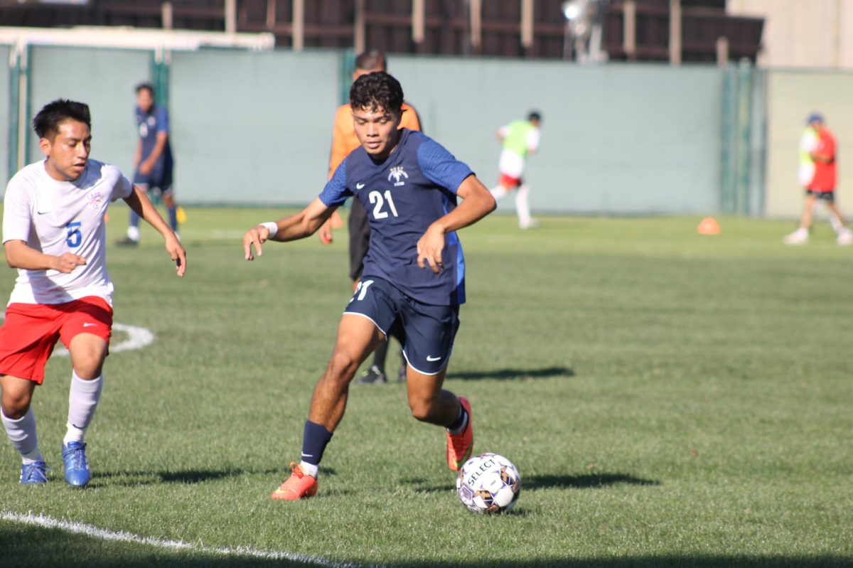 Jose Lopez dangles around LACC defender.