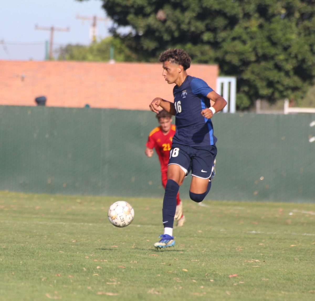 #16 Adan Gonzalez dribbling down the sideline looking for a pass Aug. 23