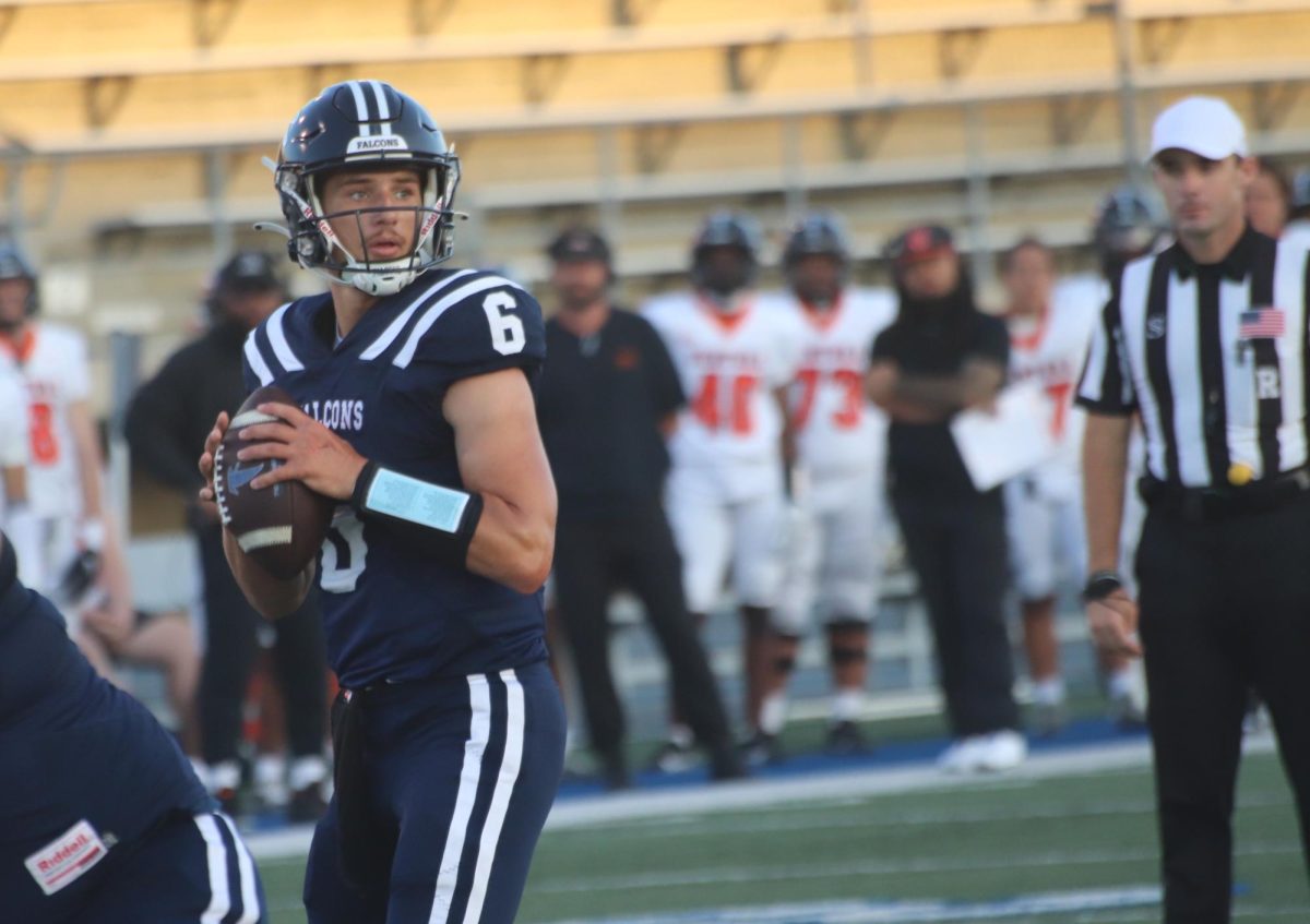 Evan Tomich #6 looking towards the end zone Sept. 21. 