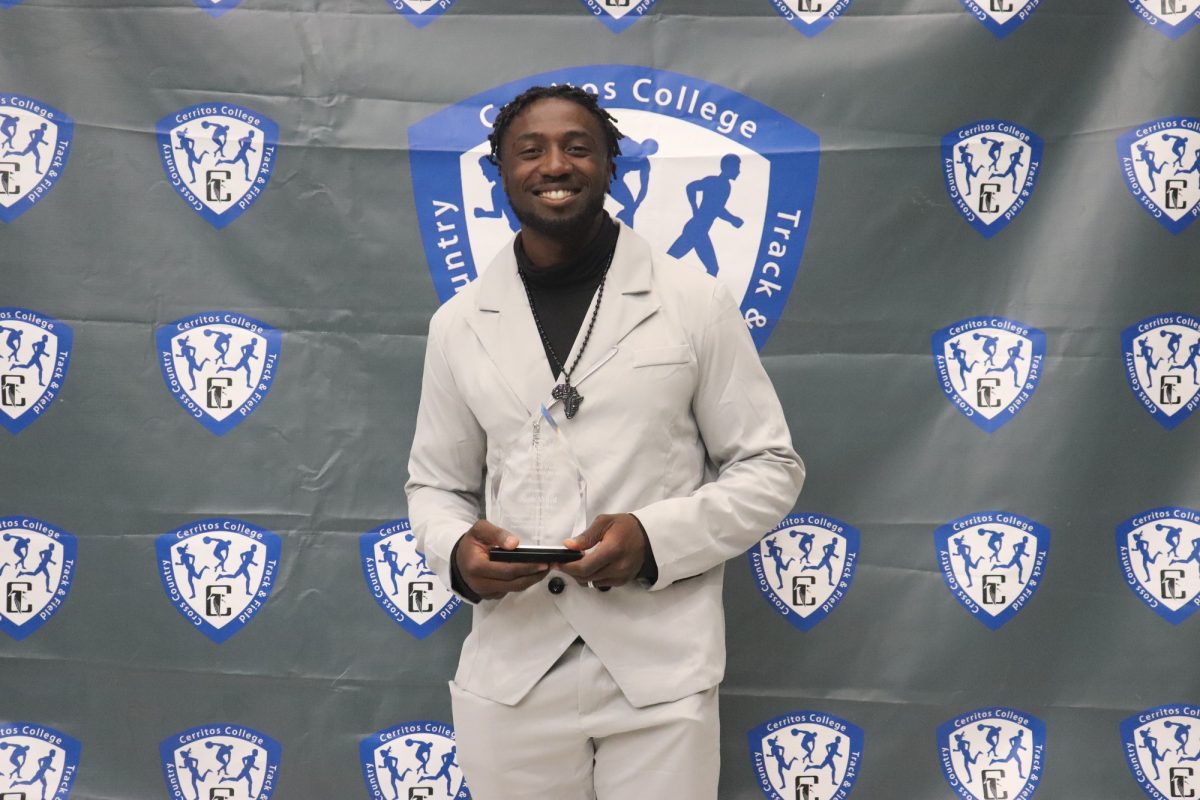 Juan Ward holding his award, "The Juan Ward Perseverance Award" 