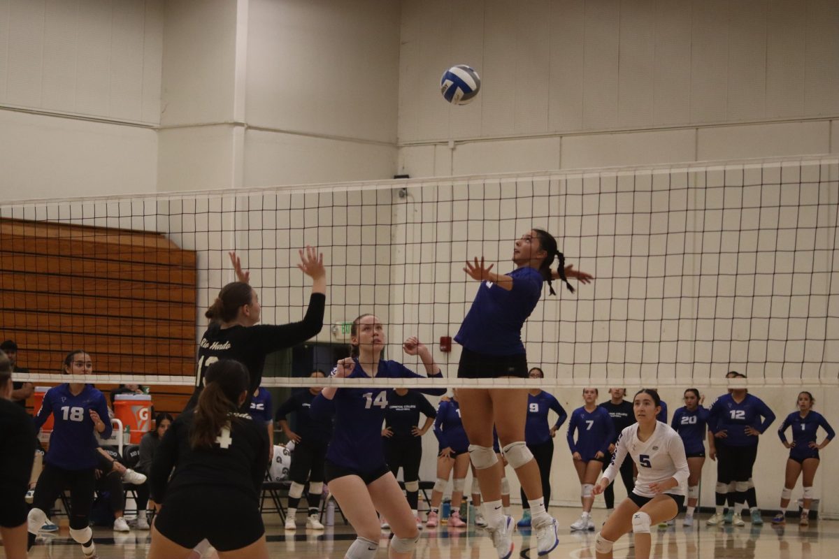 #18 Jasmine Soto-Castro going for the ball to maker a kill. Photo credit: Duran Ventura