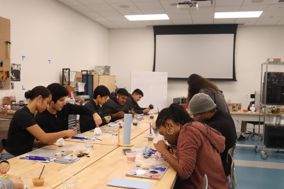 All participants painting their pumpkins during the pumpkin painting workshop at the Downey City Library in the evening on Oct. 17. Photo credit: Isaac Cordon