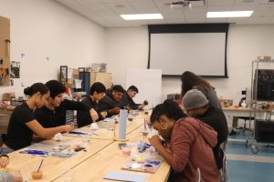 All participants painting their pumpkins during the pumpkin painting workshop at the Downey City Library in the evening on Oct. 17. 