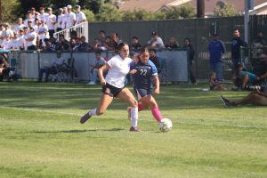 #22 Genesis Mendoz losses the ball to Long Beach City defender 