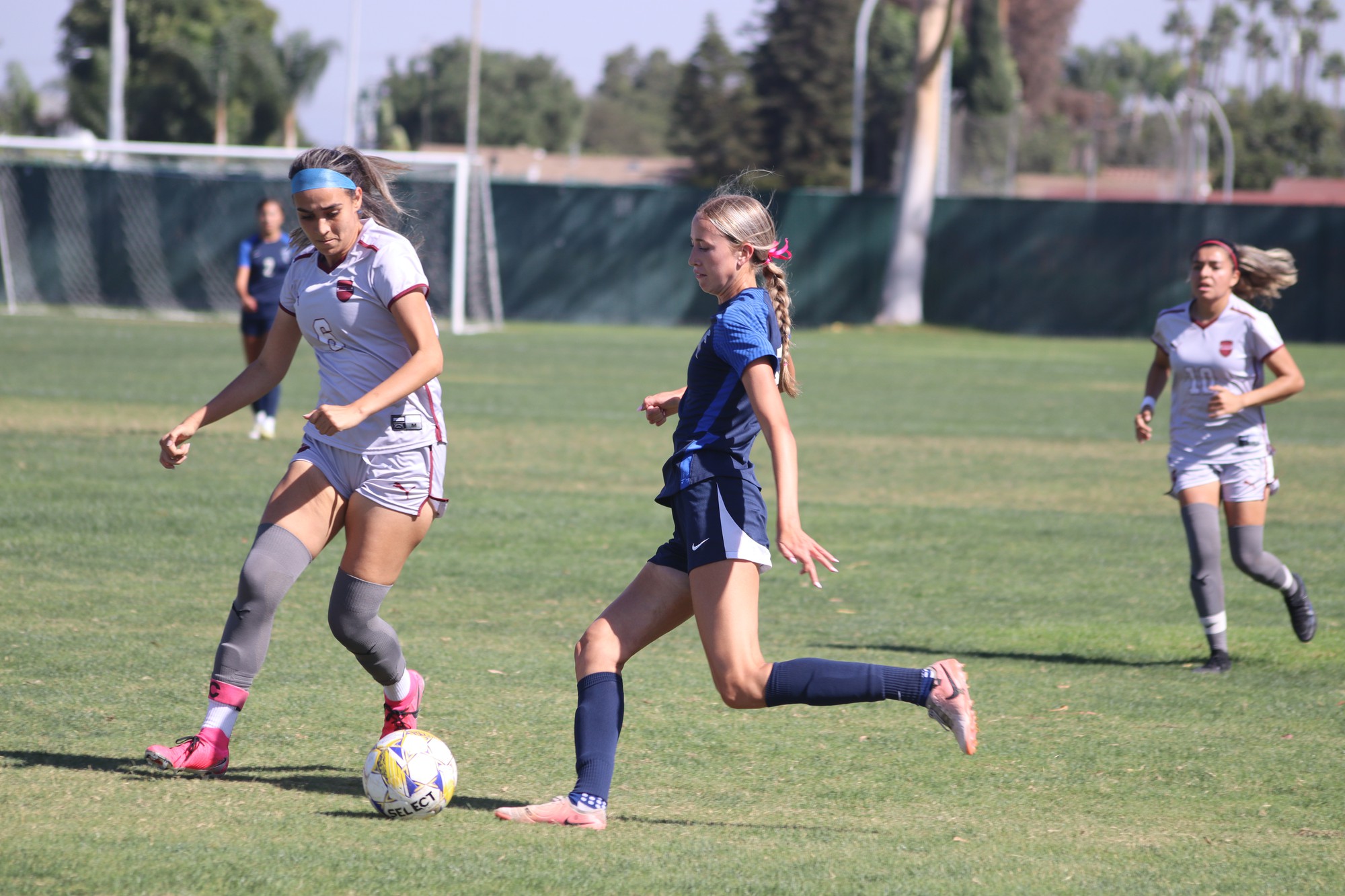 #18 Madi Jones kicking the ball in the box 