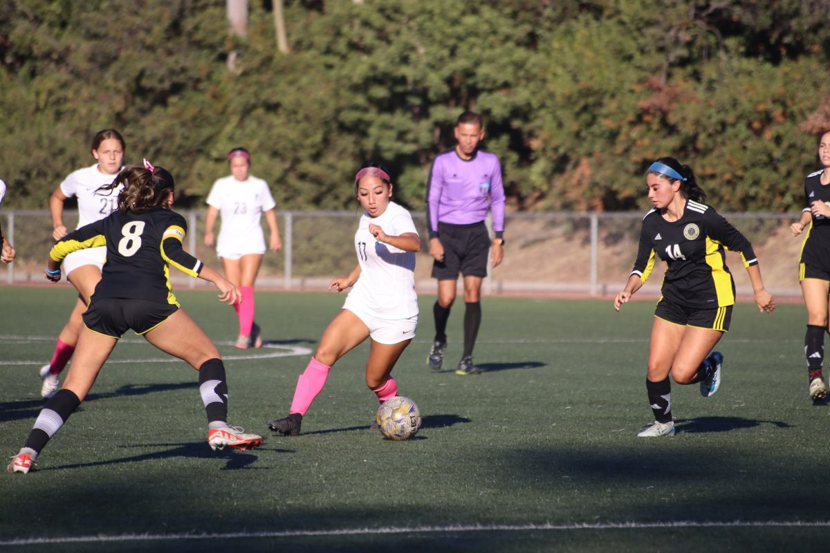 #17 Jessica Arroyo making a great run with defender #8 Ashley Caro and #14 Brianna Sanchez on her. 