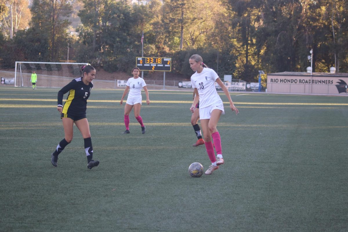 #18 Madi Jones settles as she prepares to kick the ball into the box.