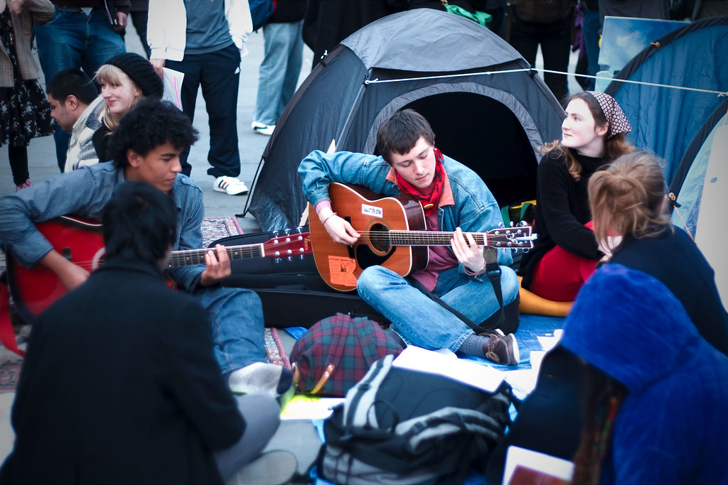 Protestors playing music at the Occupation of Trafalgar Square on April 2, 2011 in protest of  UK budget cuts.