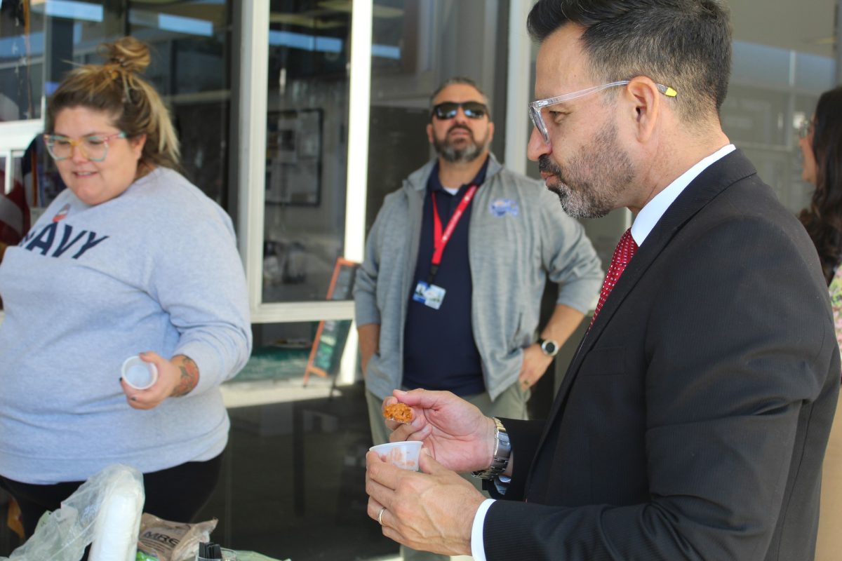 Cerritos president/superintendent, Dr. Jose Fierro, eating the beef taco sample during the MRE tasting event at the veterans resource center on Nov. 5. Photo credit: Isaac Cordon