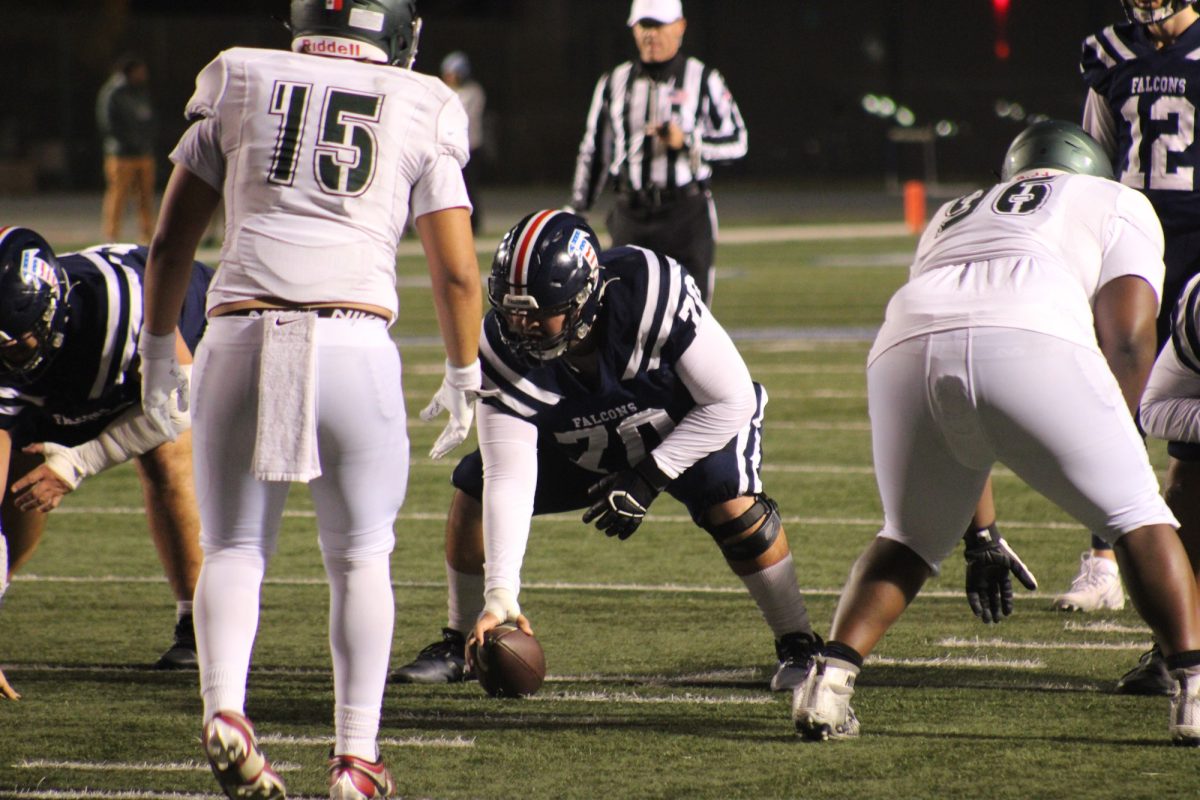 Falcons center Lawrence Pacheco, getting set before snapping the ball during the Cerritos College vs. ELAC football game on on Nov. 16, 2024. 