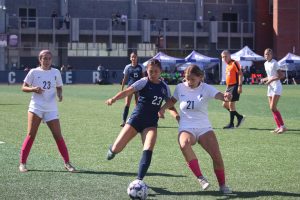 #21 Sariah Sanchez battling with #23 Sophia Hudson for possession Photo credit: Duran Ventura