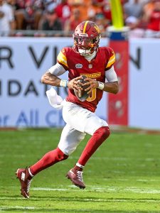 Jayden Daniels looking to make a play against the Tampa Bay Buccaneers in Raymond James Stadium on Sept. 8 2024. Photo credit: Joe Glorioso/All-Pro Reels