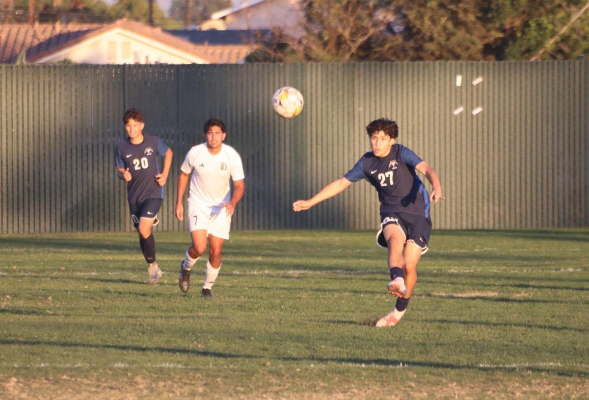 #17 Edgar Ausencio kicking the ball up field on the left wing Photo credit: Duran Ventura