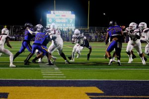 Senior running back/middle linebacker Bernardo Blanco rushing towards the endzone Photo credit: Jonathan Diaz