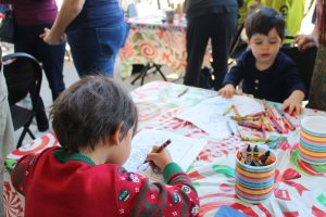 At the Santa's Village event, on Dec. 7, kids were given coloring pages of trees and the grinch and crayons. The arts and crafts tables were set outside of the fine arts building. 