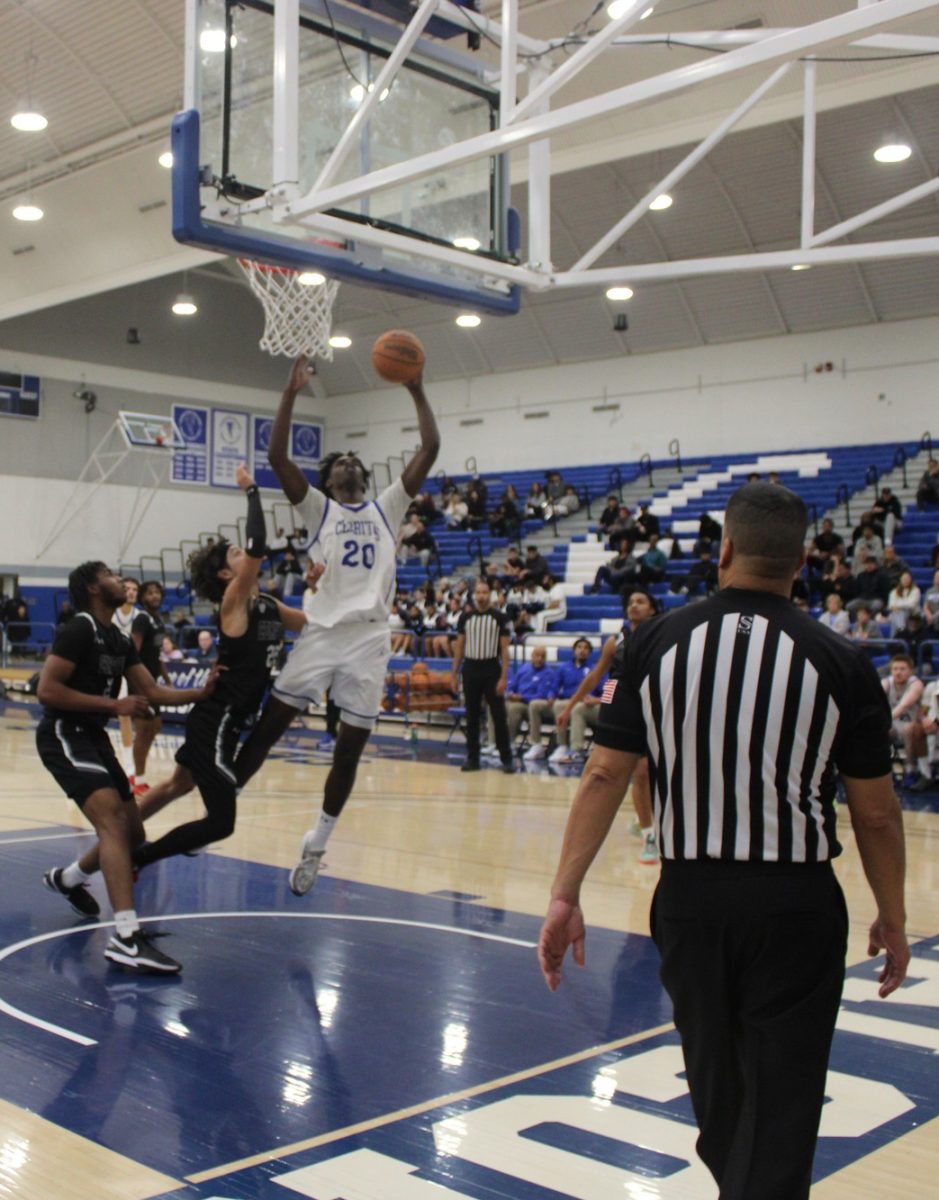 Cerritos College center, Spencer Ezewiro, trying to get a layup right under the rim during the Cerritos College vs. Compton College men's basketball game on Jan. 23, 2025.