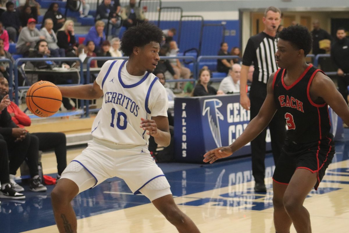 Cerritos College sophomore guard Marcel Hayes 
dribbling alongside the endline against Long Beach City College on Feb. 19, 2025.