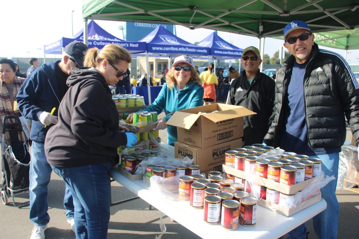 Volunteers and Attendees at the LA Regional Food Bank distribution in Cerritos College's parking lot 1 next to Alondra Boulevard on Feb. 19, 2025.