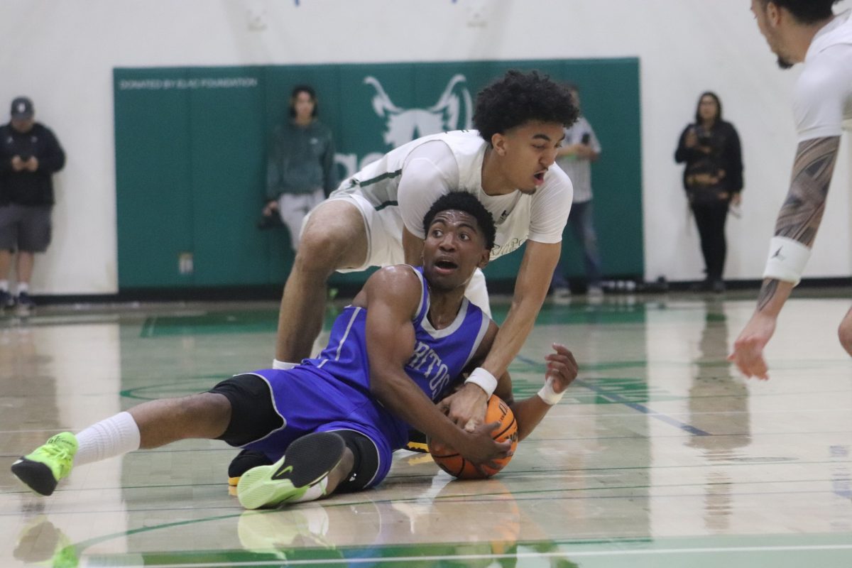 Falcons guard, Darron Henry, fighting with guard/forward, Esteban Mann, for a loose ball during the 3C2A SoCal Regional Final on March 8, 2025.