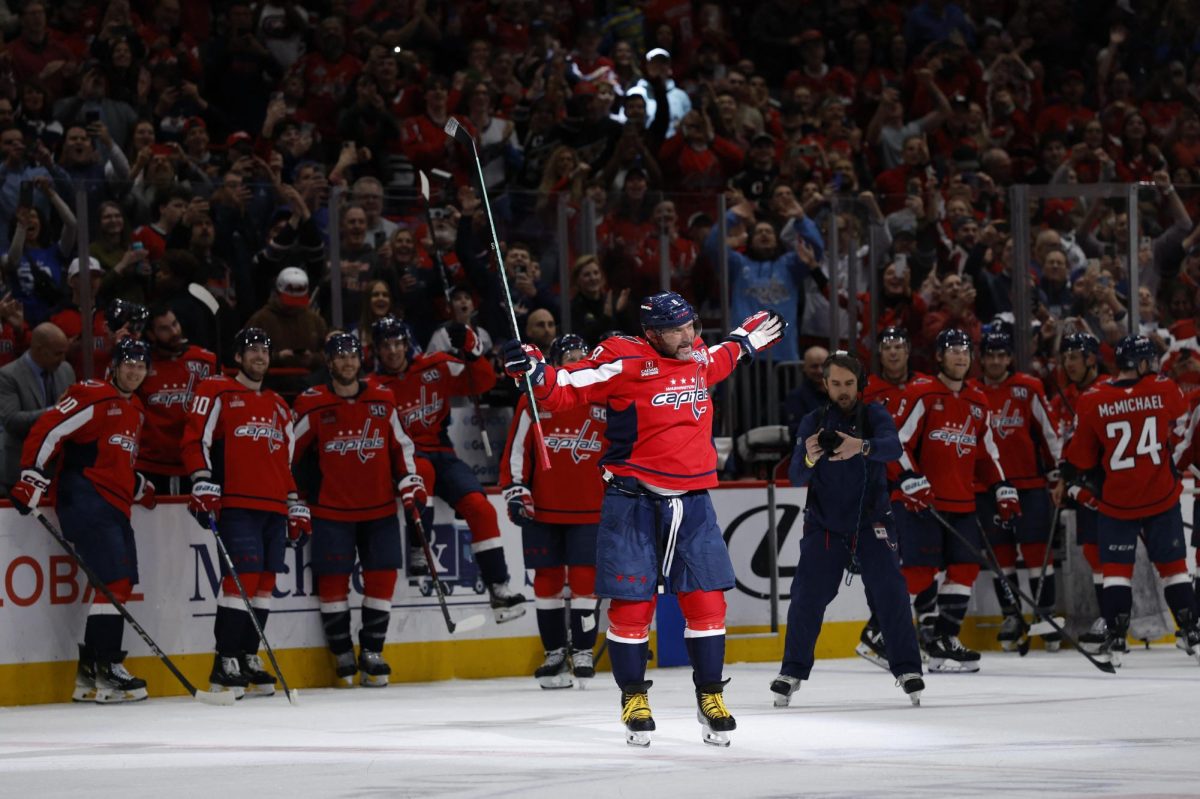 Apr 4, 2025; Washington, District of Columbia, USA; Washington Capitals left wing Alex Ovechkin (8) celebrates after scoring a goal against the Chicago Blackhawks in the third period at Capital One Arena. The goal is the 894th of his career, tying Wayne Gretzky for most all-time goals scored in the NHL. Mandatory Credit: Geoff Burke-Imagn Images
