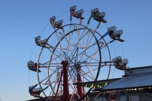 Carnival attendees enjoy the Ferris Wheel during day one of the annual Our Lady of Perpetual Help Carnival on April 11, 2025.